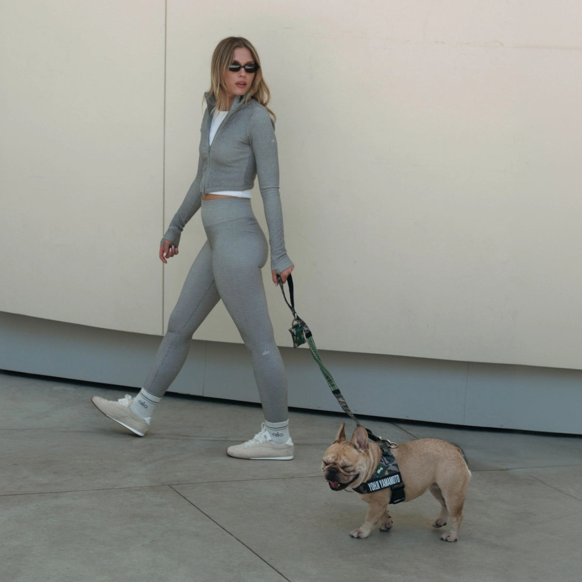 Person walking a dog with a Green Camo bungee dog leash.