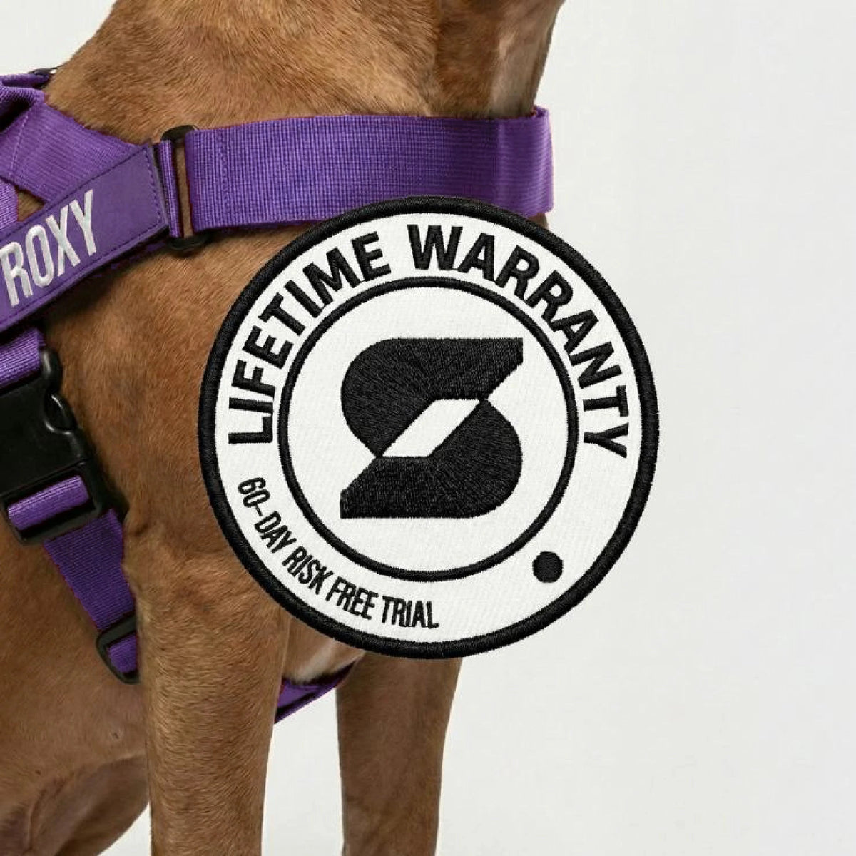 Lifetime Warranty, 60-day risk free trial badge over a dog wearing the Indigo harness
